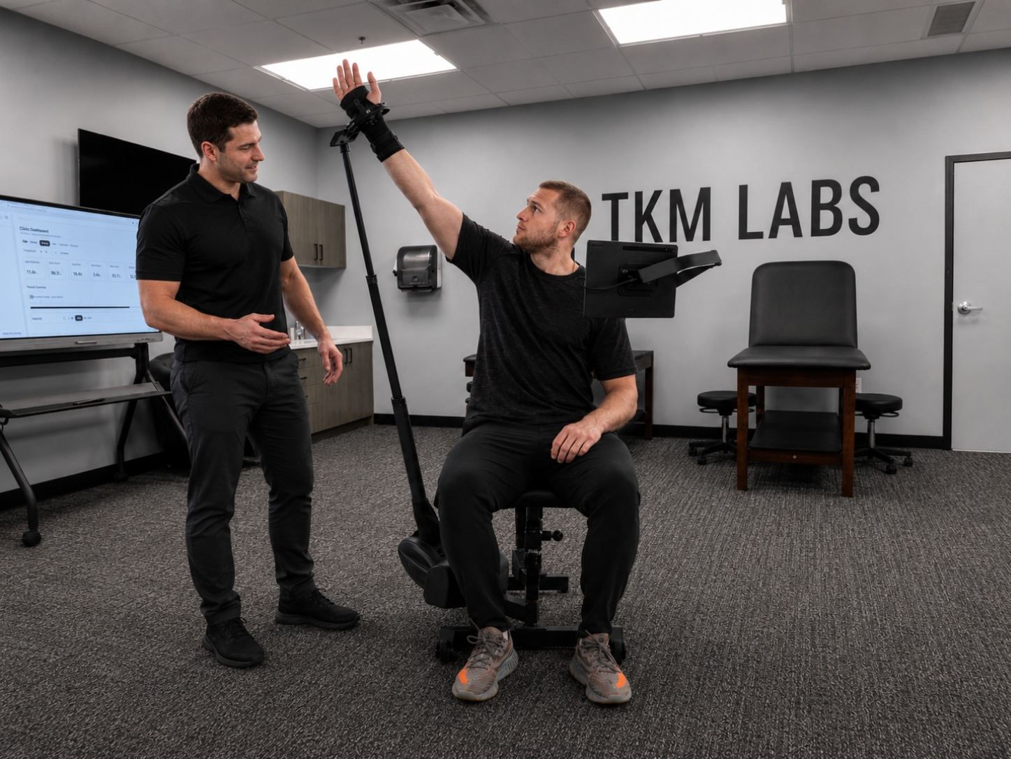 Athlete training shoulder strength on the Humero Tech C1 during sports medicine physical therapy