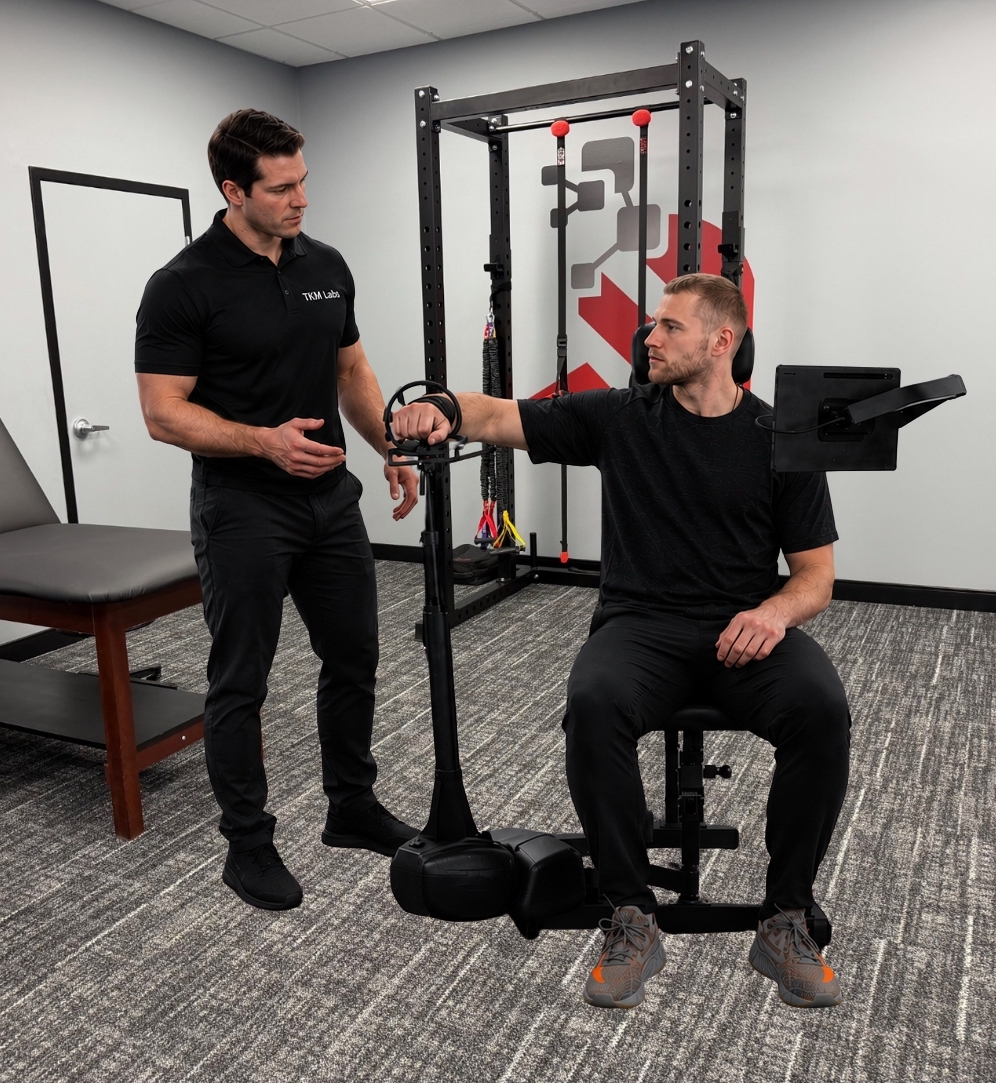 Physical therapist working one-on-one with a patient on shoulder rehabilitation